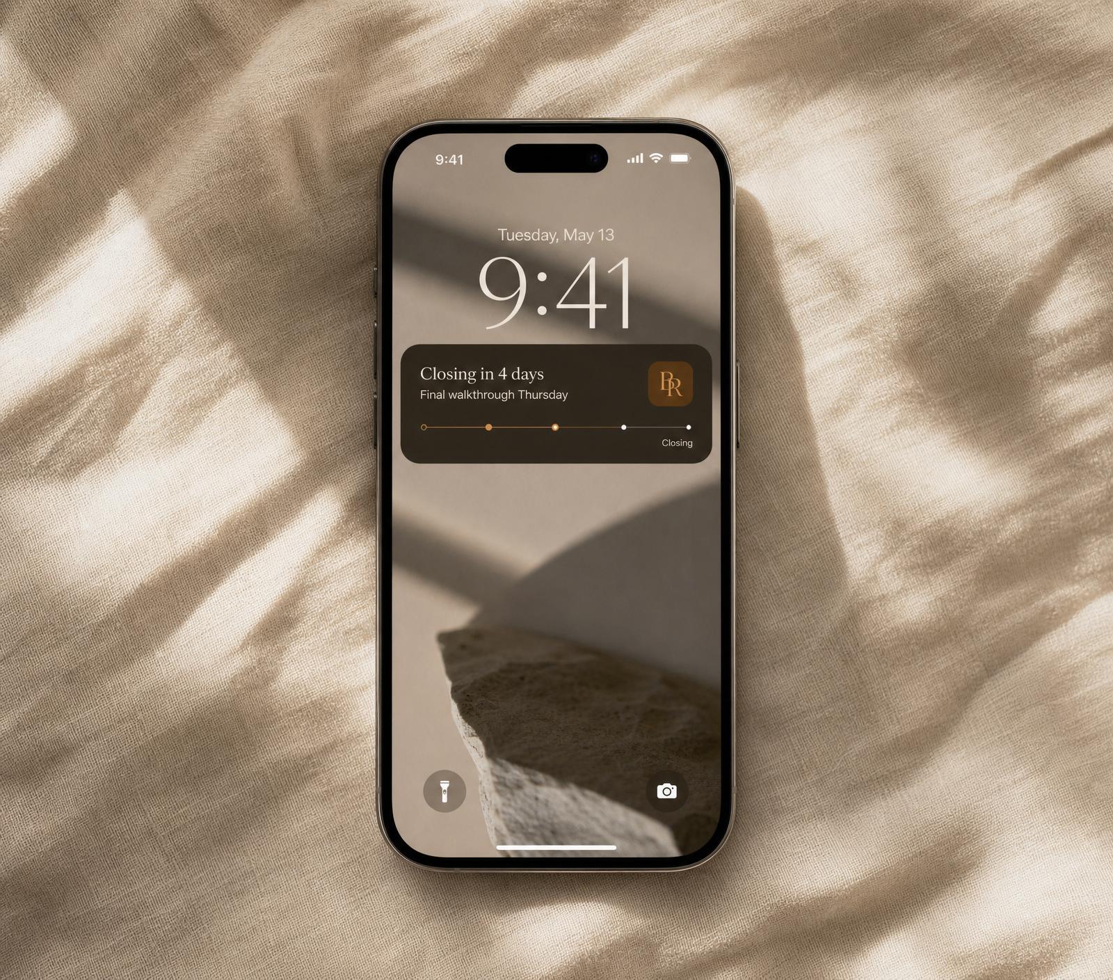 An agent-branded iPhone app showing a closing-week Live Activity on the lock screen
